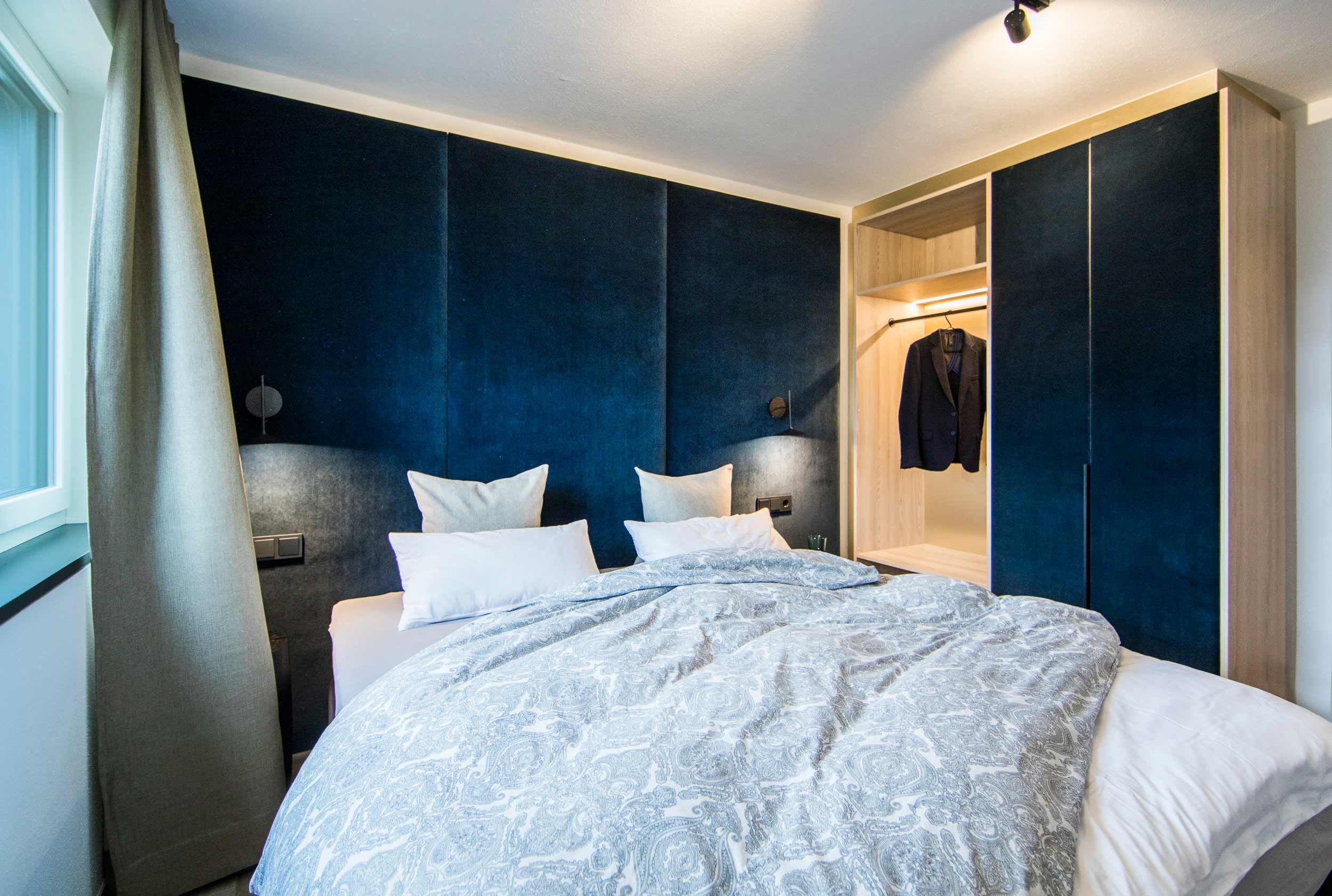 RIDERS Suite: Schlafzimmer mit Doppelbett